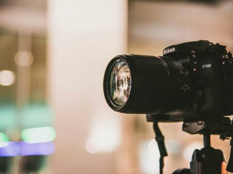 black Nikon DSLR camera focus photo